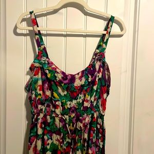 Floral multi color high low dress with ruffle on top. Like new